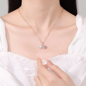 Natural freshwater pearl and s925 silver cherry pendant necklace worn by a female model