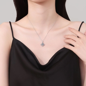 Elegant S925 sterling silver clover necklace with 1-carat moissanite pendant on model