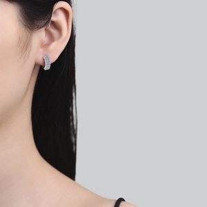 Elegant S925 sterling silver hoop earrings with triple-row moissanite diamonds on model