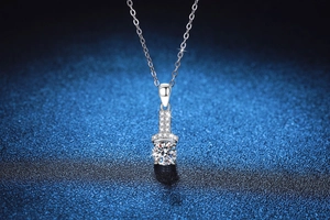 Macro shot of S925 sterling silver necklace featuring round brilliant cut moissanite pendant