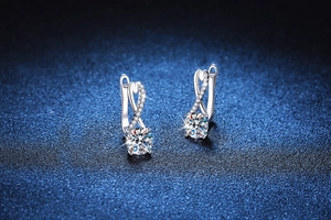 Macro view of S925 sterling silver infinity earrings with sparkling moissanite stones