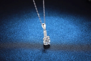 Macro shot of 1 carat round brilliant cut moissanite pendant on S925 silver chain