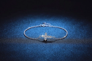 Macro view of adjustable S925 silver cross bracelet with shimmering D color moissanite