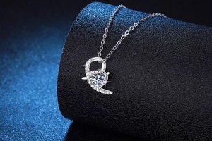 Macro detail of S925 sterling silver heart pendant with shimmering 1ct moissanite stone