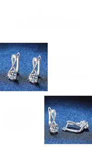 Detail of 925 sterling silver figure-eight earrings with round moissanite in 4-prong setting