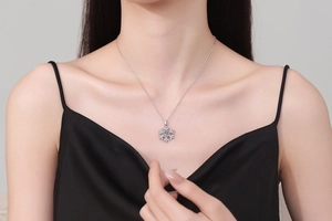 Detailed view of the sparkling snowflake pendant with a round moissanite center stone