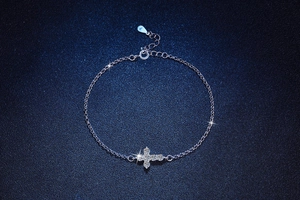 Detailed view of S925 sterling silver cross bracelet with sparkling moissanite stones