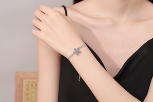 Detailed view of an adjustable S925 sterling silver cherry blossom moissanite bracelet