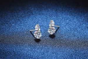 Detailed close-up of S925 sterling silver double moissanite heart-shaped stud earrings