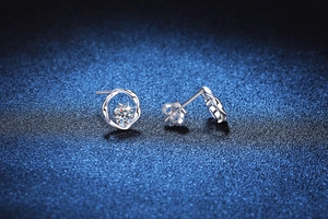 Macro view of S925 silver Moissanite stud earrings with a Mobius wrap design