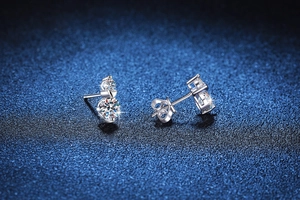 Macro shot of S925 silver stud earring featuring heart design and moissanite stone
