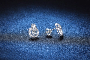 Macro view of S925 sterling silver halo moissanite studs with sparkling round cut stones