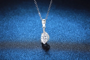 Macro detail of marquise-cut moissanite pendant with micro-pave setting on S925 silver