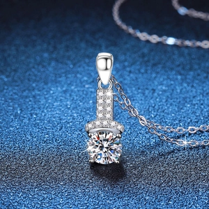 Sparkling S925 sterling silver necklace featuring a 1 carat round moissanite pendant