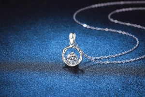 Macro shot of 1ct Moissanite Mobius pendant on a delicate S925 sterling silver chain