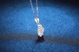 Macro shot of s925 silver marquise-cut moissanite pendant with sparkling halo details