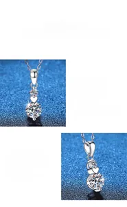 Dettaglio macro del ciondolo cuore e stella in argento S925 con moissanite da 1 carato