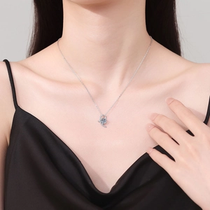 Elegant S925 silver heart necklace with blue moissanite pendant worn by model