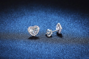 Macro detail of S925 sterling silver heart stud earring with 1 carat moissanite center