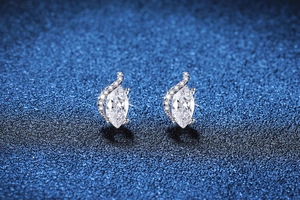 Detailed macro of S925 silver marquise-cut moissanite earrings with side accents