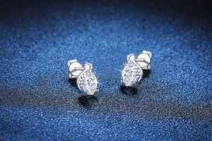 Macro detail of marquise-cut Moissanite stud earrings in S925 sterling silver claw setting