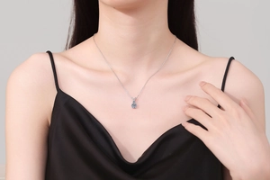 Elegant 1 carat Moissanite pendant necklace worn by a model on a delicate silver chain