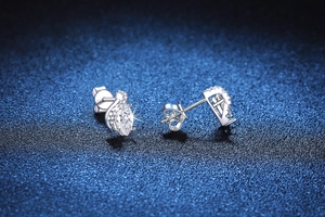 Macro detail of S925 silver marquise-cut Moissanite studs with fine polished finish