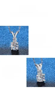 Macro detail of round brilliant-cut moissanite pendant with classic four-prong silver setting