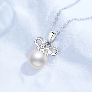 S925 sterling silver bow pendant necklace with Moissanite and freshwater pearl on snow