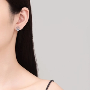 Elegant S925 sterling silver Moissanite stud earring worn on model's ear