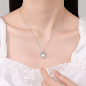 Elegant S925 silver necklace featuring a natural pearl and sparkling bow pendant