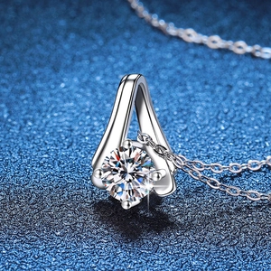 Classic S925 sterling silver necklace with a 1-carat round moissanite pendant on blue background