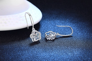 Macro shot of S925 sterling silver flower drop earrings with moissanite crystals