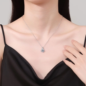 Elegant S925 sterling silver necklace featuring a 1 carat moissanite pendant on a model