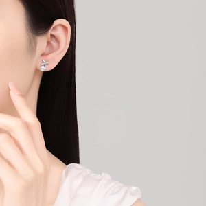 S925 silver stud earrings with X-shaped moissanite design and white freshwater pearl