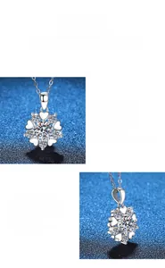 Détail macro du pendentif flocon en argent S925 avec moissanite 1ct sur fond bleu
