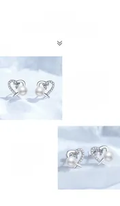 Detail of S925 silver heart stud earrings with freshwater pearl and moissanite stones