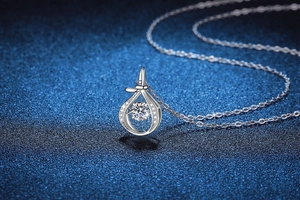 Macro shot of S925 sterling silver dancing stone necklace with water drop pendant