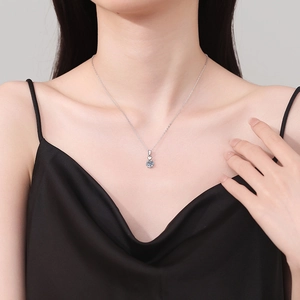 S925 sterling silver necklace with heart moissanite pendant worn by a model