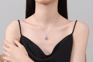 Close-up of 925 sterling silver necklace with a sparkling 1 carat moissanite flower pendant