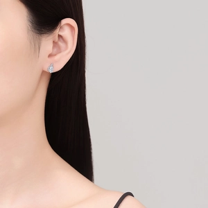 S925 sterling silver marquise cut moissanite stud earrings shown on model ear