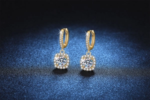 Detailed close-up of 14k gold plated moissanite hoop earrings with square halo drop pendants