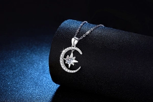 Macro shot of S925 silver moon and star pendant necklace with Moissanite stones