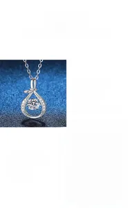 Macro detail of S925 sterling silver Mobius necklace featuring a sparkling moissanite stone