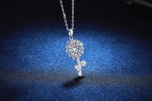 Macro shot of S925 silver sunflower pendant featuring a sparkling moissanite center stone