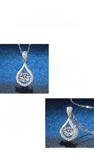 Close-up of teardrop moissanite pendant with circular main stone and halo in 925 silver