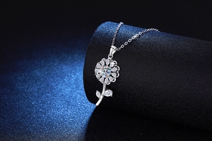 Close-up of S925 sterling silver sunflower pendant with 1ct moissanite on display