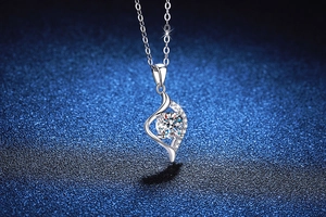 Macro shot of S925 sterling silver heart necklace with 1 carat moissanite pendant detail
