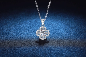 Detailed view of S925 silver four-leaf clover pendant with sparkling moissanite stones