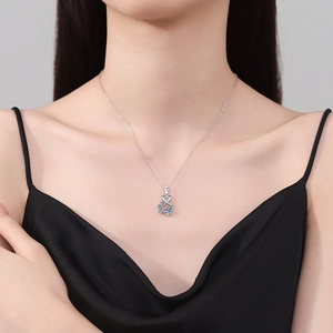 Elegant 925 sterling silver necklace with a brilliant 1ct moissanite pendant on a model